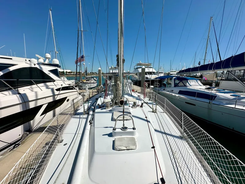 Slide: The Image of Concordia 52 sailboat, 1989 model, docked at a marina with other boats. - 29