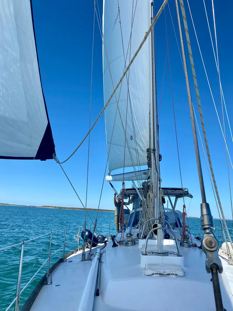 Slide: The Image of Sailing on a 1989 Concordia 52 yacht with full sails on a clear day. - 3