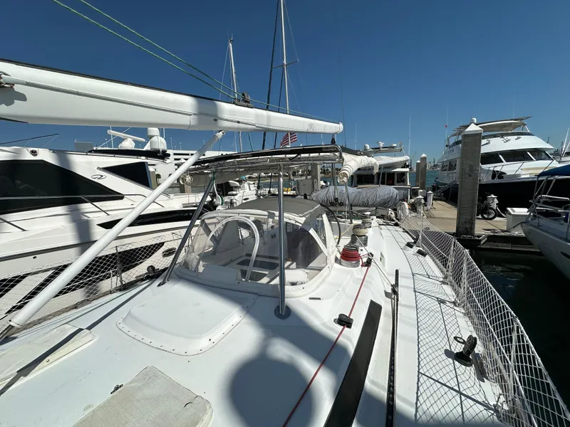 Slide: The Image of Concordia 52 sailboat docked at marina, 1989 model, clear blue sky. - 33