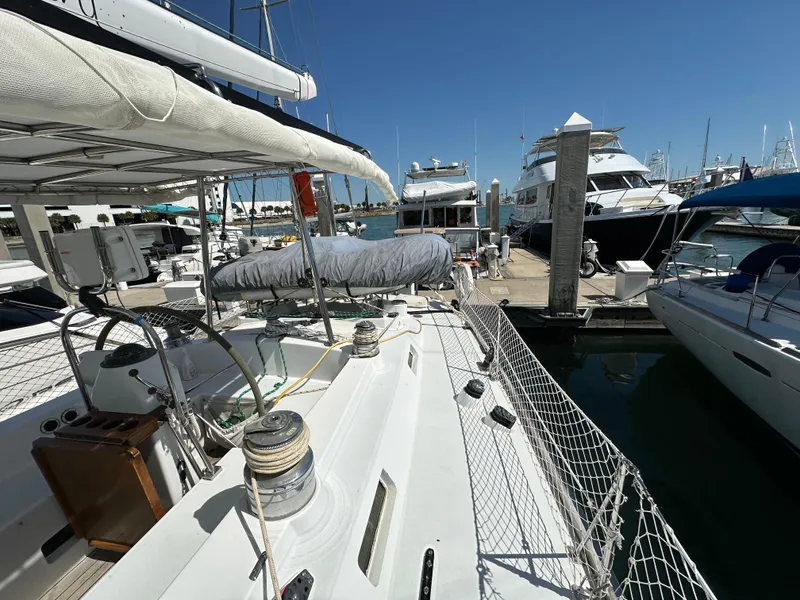 Slide: The Image of Concordia 52 sailboat docked at marina, 1989 model, sunny day, other boats in background. - 37