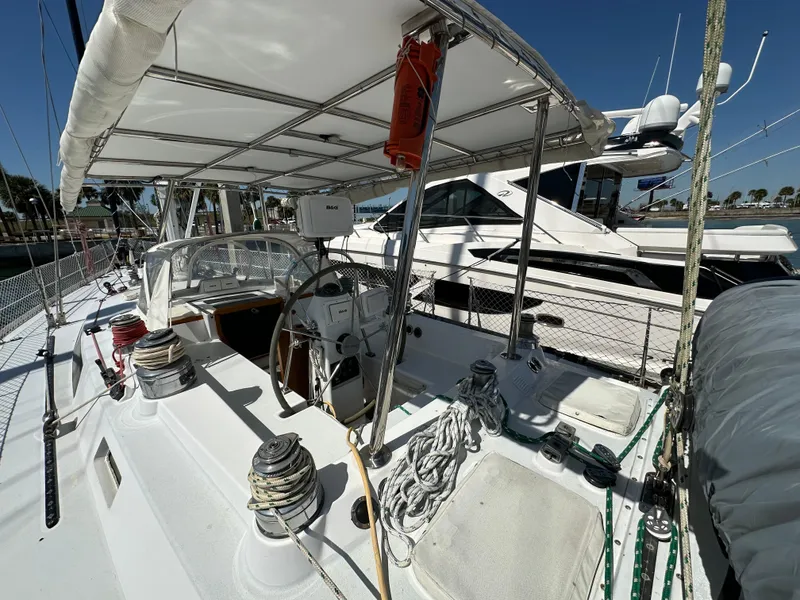 Slide: The Image of Concordia 52 sailboat, 1989 model, docked at marina with covered cockpit and steering wheel. - 39