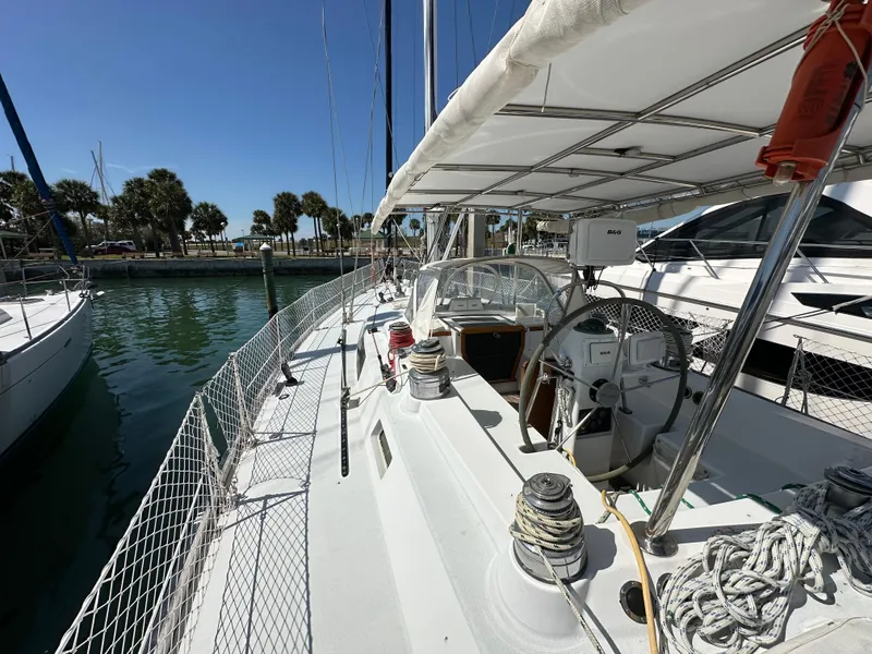 Slide: The Image of Concordia 52 sailboat, 1989 model, docked at marina with clear blue sky. - 40