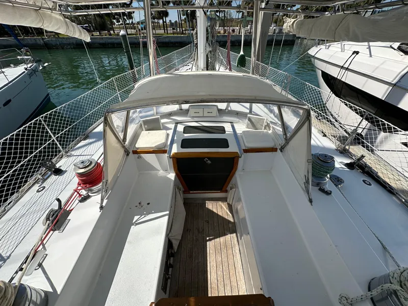 Slide: The Image of Cockpit view of a 1989 Concordia 52 sailboat docked at a marina. - 41