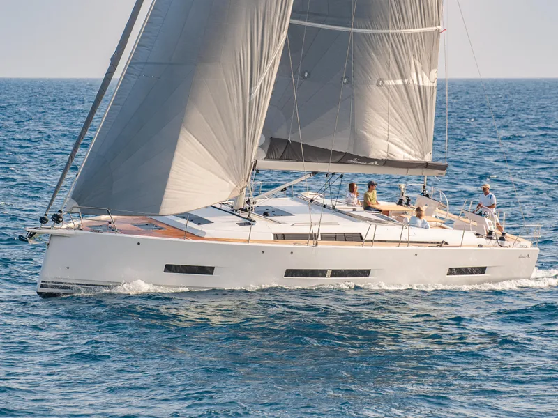Slide: The Image of 2024 Hanse 510 sailing yacht cruising on open water. - 23