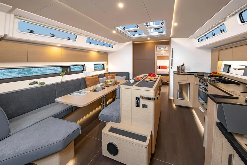 Slide: The Image of Luxurious interior of the 2024 Hanse 510 yacht with modern furnishings and ample natural light. - 9