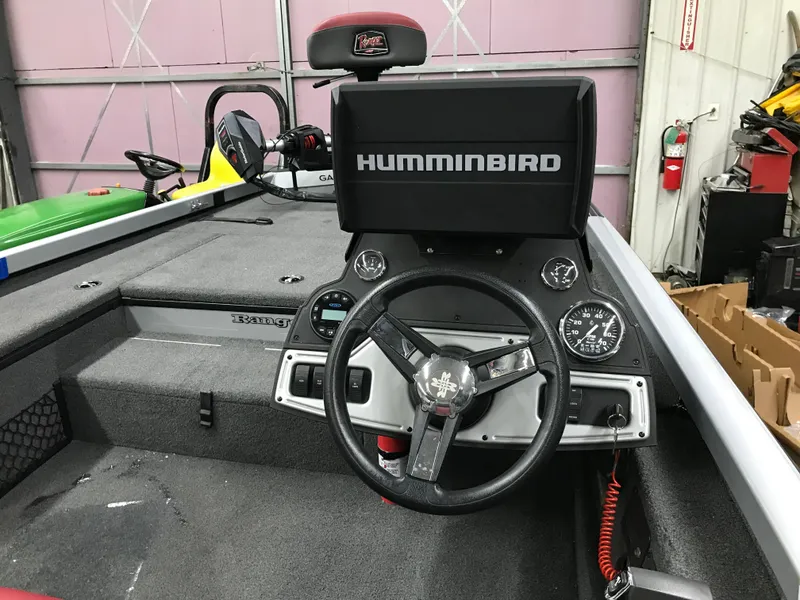 Slide: The Image of 2018 Ranger RT178 boat dashboard with Humminbird fishfinder and steering wheel. - 25