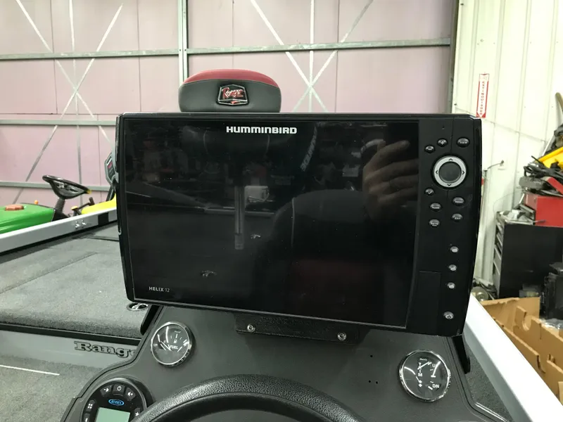 Slide: The Image of Humminbird fish finder on 2018 Ranger RT178 boat dashboard in a garage setting. - 26