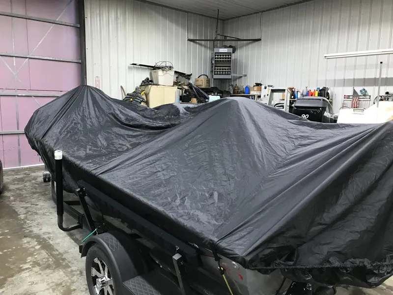 Slide: The Image of 2018 Ranger RT178 boat covered in a garage, showcasing storage and protection. - 29