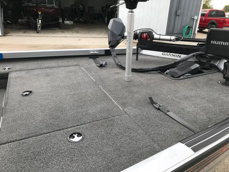 Slide: The Image of 2018 Ranger RT178 boat deck with Garmin and Humminbird equipment in a garage setting. - 33