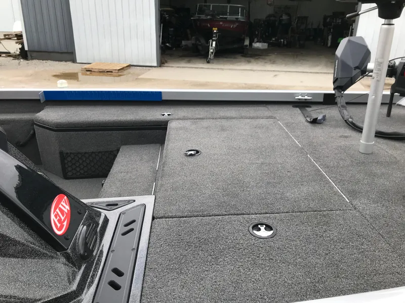 Slide: The Image of 2018 Ranger RT178 boat interior with storage compartments and fishing equipment. - 34