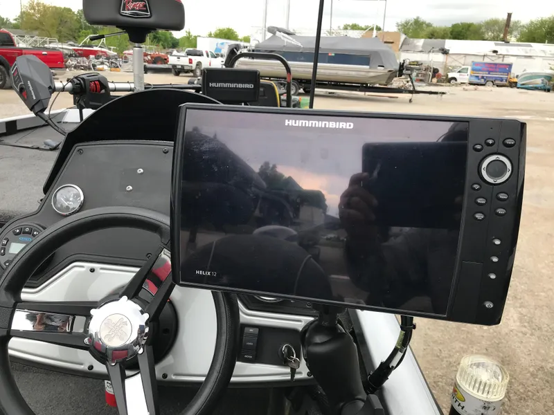 Slide: The Image of 2018 Ranger RT178 boat dashboard with Humminbird Helix 12 fish finder and steering wheel. - 44