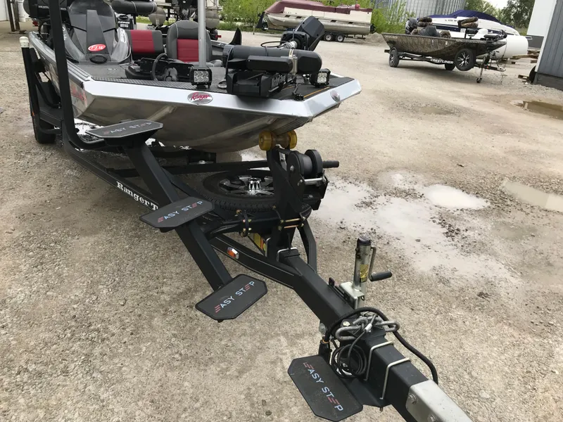 Slide: The Image of 2018 Ranger RT178 boat on trailer, featuring Easy Step system, parked outdoors. - 48