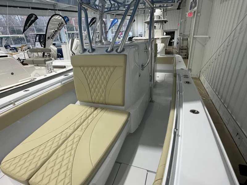 Slide: The Image of 2025 Contender 32 ST boat interior with beige seating and modern design. - 10