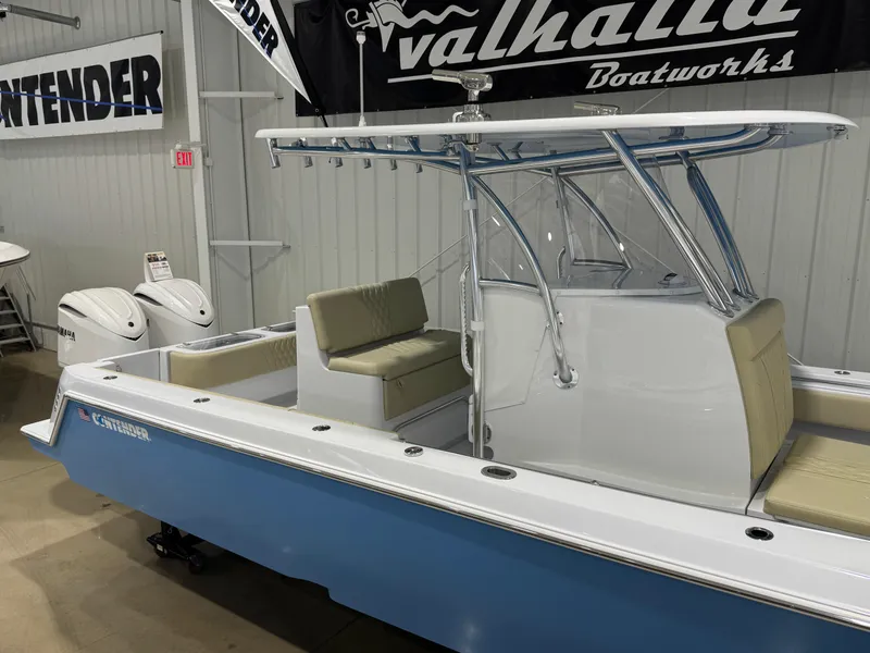 Slide: The Image of 2025 Contender 32 ST boat in showroom, featuring sleek design and modern amenities. - 4
