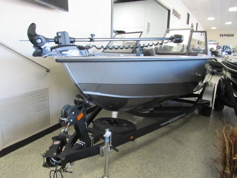 Slide: The Image of 2024 Vexus ADX 190 boat on a trailer in a showroom. - 0
