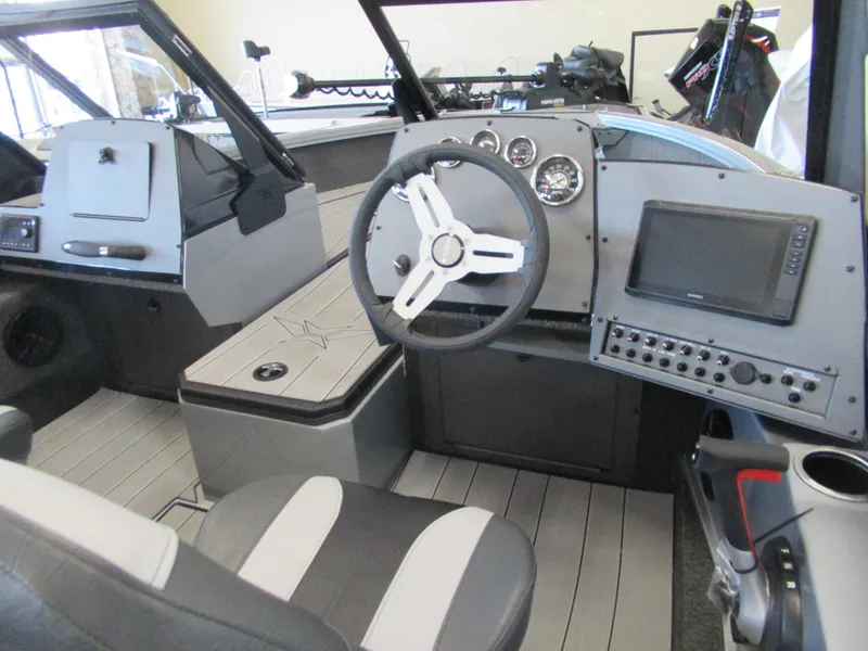 Slide: The Image of 2024 Vexus ADX 190 boat interior with modern dashboard and steering wheel. - 3