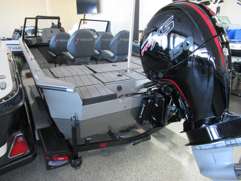 Slide: The Image of 2024 Vexus ADX 190 boat with Mercury 150 outboard motor, rear view in showroom. - 4
