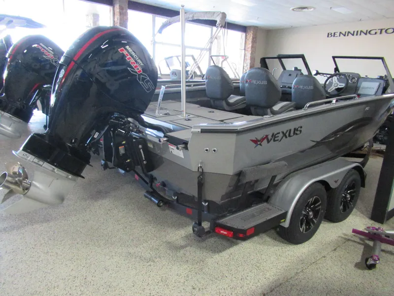 Slide: The Image of 2024 Vexus ADX 190 boat with outboard motor in showroom. - 5