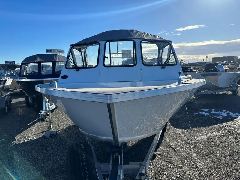 Slide: The Image of 2024 Weldcraft 200 Revolution boat on trailer in outdoor lot. - 2