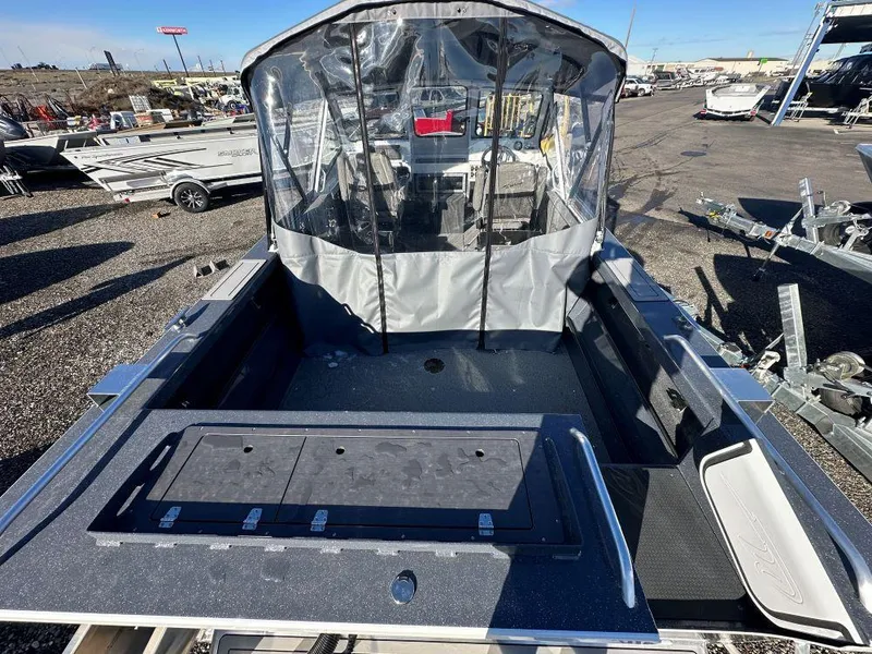 Slide: The Image of 2024 Weldcraft 200 Revolution boat with covered cockpit and spacious deck. - 4