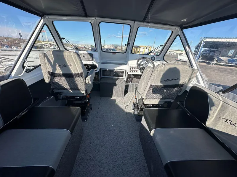 Slide: The Image of 2024 Weldcraft 200 Revolution boat interior with seating and steering console. - 5