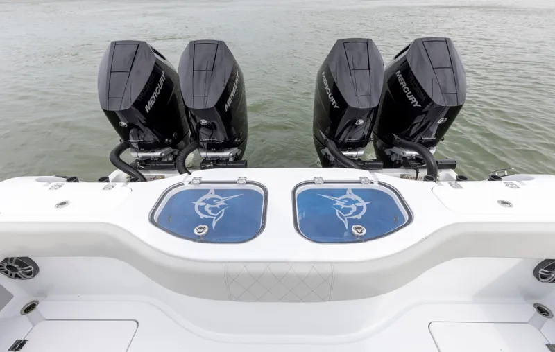 Slide: The Image of 2024 Freeman 42 LR boat with four Mercury outboard engines and dual livewells. - 14