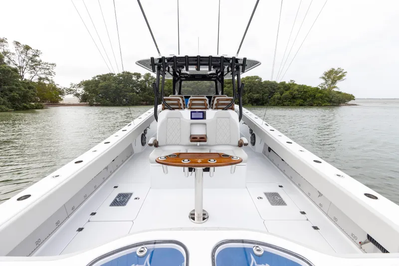 Slide: The Image of 2024 Freeman 42 LR boat interior with seating and fishing rod holders. - 16