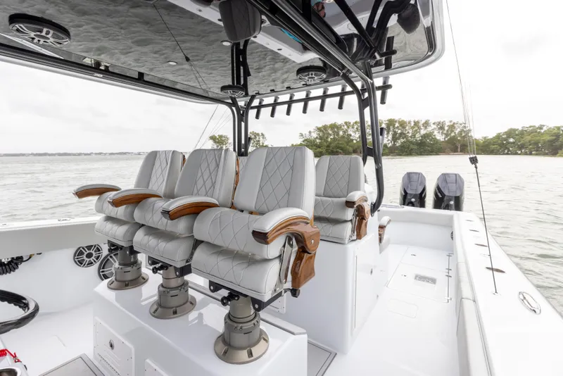 Slide: The Image of Luxurious seating on the 2024 Freeman 42 LR boat with dual outboard motors. - 34