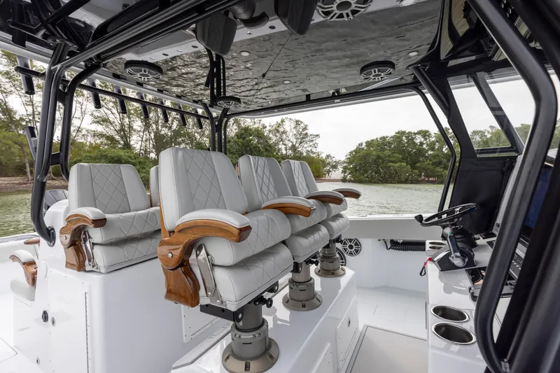 Slide: The Image of Luxurious seating on the 2024 Freeman 42 LR boat, featuring premium leather and wood accents. - 35