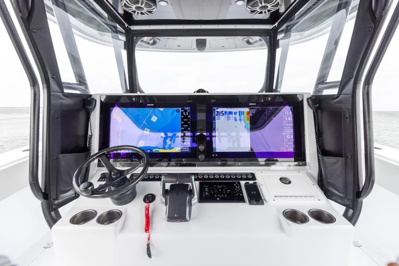 Slide: The Image of Freeman 42 LR 2024 boat dashboard with advanced navigation screens and controls. - 41