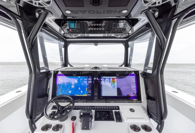Slide: The Image of 2024 Freeman 42 LR boat cockpit with advanced navigation systems and dual screens. - 42