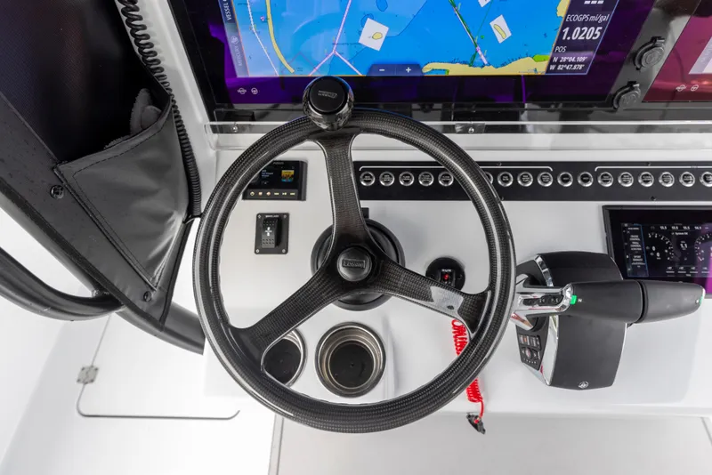 Slide: The Image of 2024 Freeman 42 LR boat helm with navigation display and controls. - 45