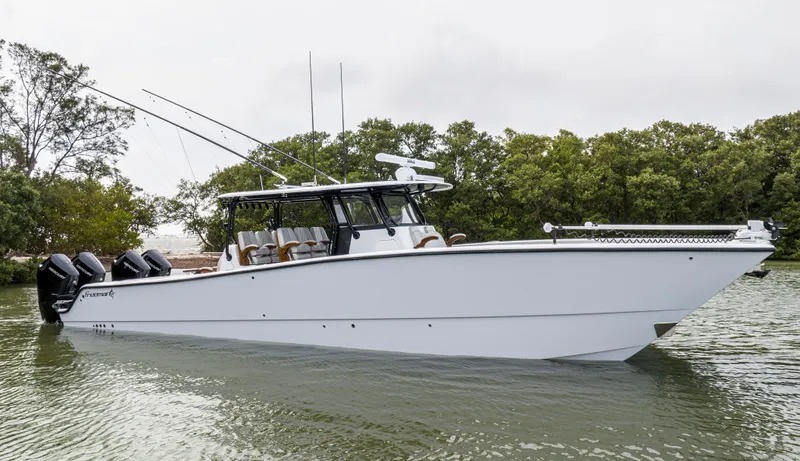 Slide: The Image of 2024 Freeman 42 LR boat on water with trees in background. - 7