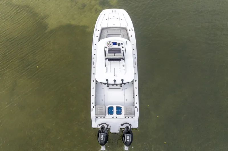 Slide: The Image of Aerial view of 2024 Freeman 28 boat with twin outboard motors. - 13