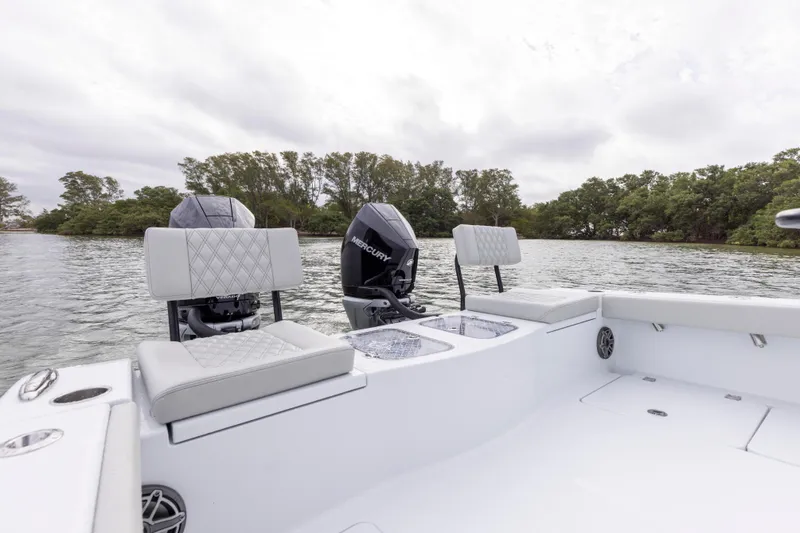 Slide: The Image of 2024 Freeman 28 boat with Mercury engines on a calm lake. - 17