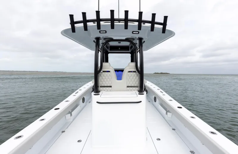 Slide: The Image of 2024 Freeman 28 boat on open water, featuring a sleek design and modern seating. - 18