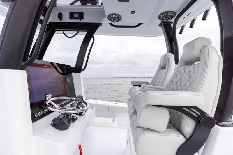 Slide: The Image of 2024 Freeman 28 boat interior with modern helm and luxurious seating. - 21