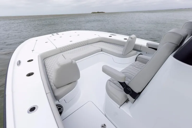 Slide: The Image of 2024 Freeman 28 boat with spacious seating and modern design on calm waters. - 25