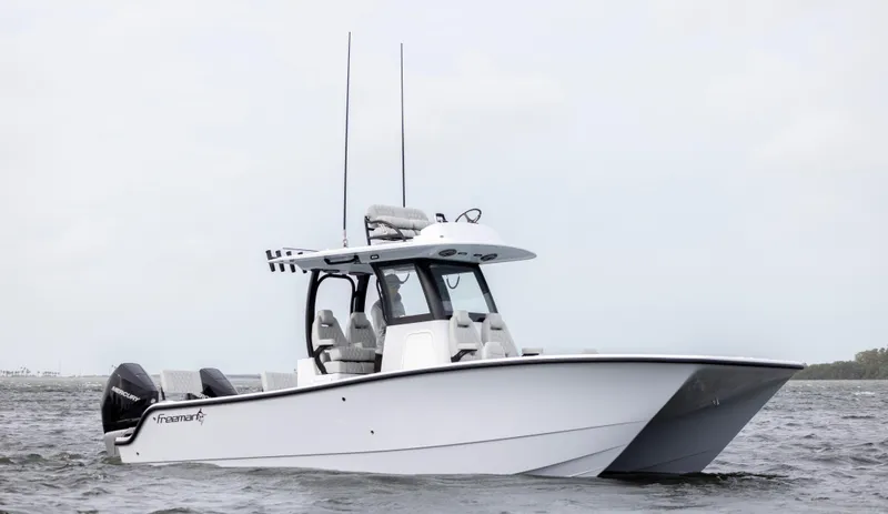 Slide: The Image of 2024 Freeman 28 boat on water with twin engines. - 3