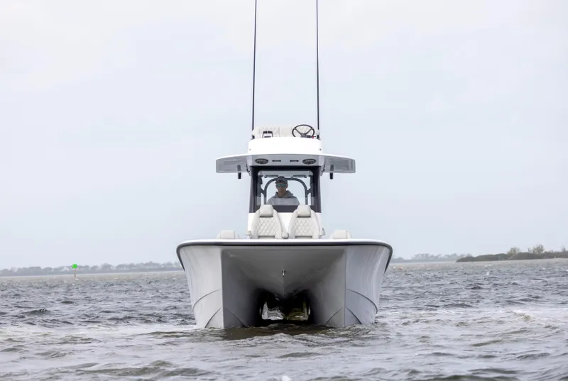 Slide: The Image of 2024 Freeman 28 boat on open water, front view. - 8