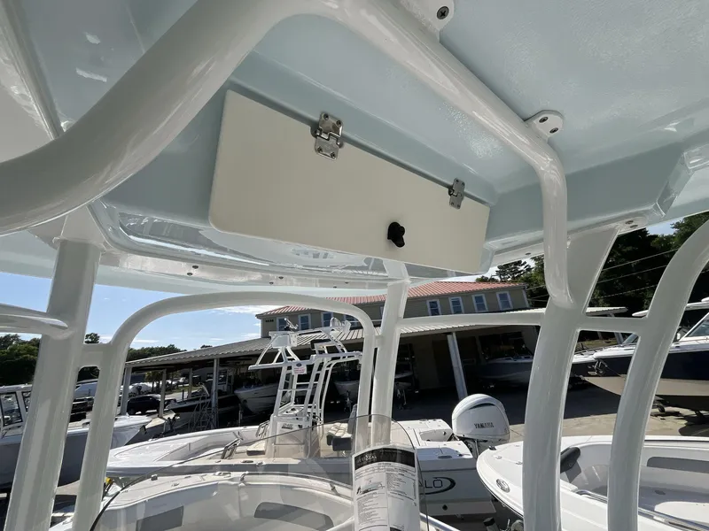 Slide: The Image of 2024 Robalo 222 Explore boat interior with overhead storage compartment. - 10