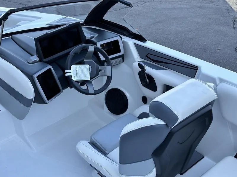 Slide: The Image of 2024 Malibu 21 LX-R boat interior with modern dashboard and steering wheel. - 4