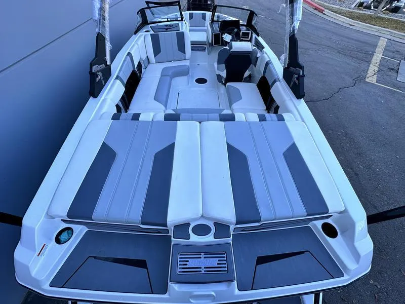 Slide: The Image of 2024 Malibu 21 LX-R boat interior with gray and white seating. - 5