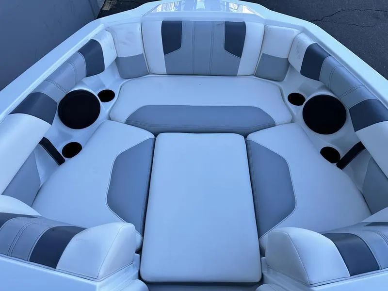 Slide: The Image of 2024 Malibu 21 LX-R boat interior with white and gray seating. - 6