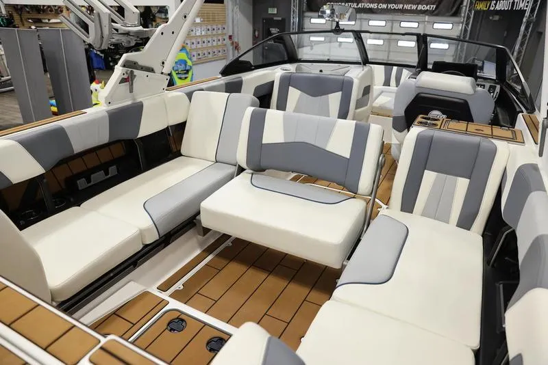 Slide: The Image of 2024 Malibu 24 MXZ boat interior with luxurious seating and modern design. - 10