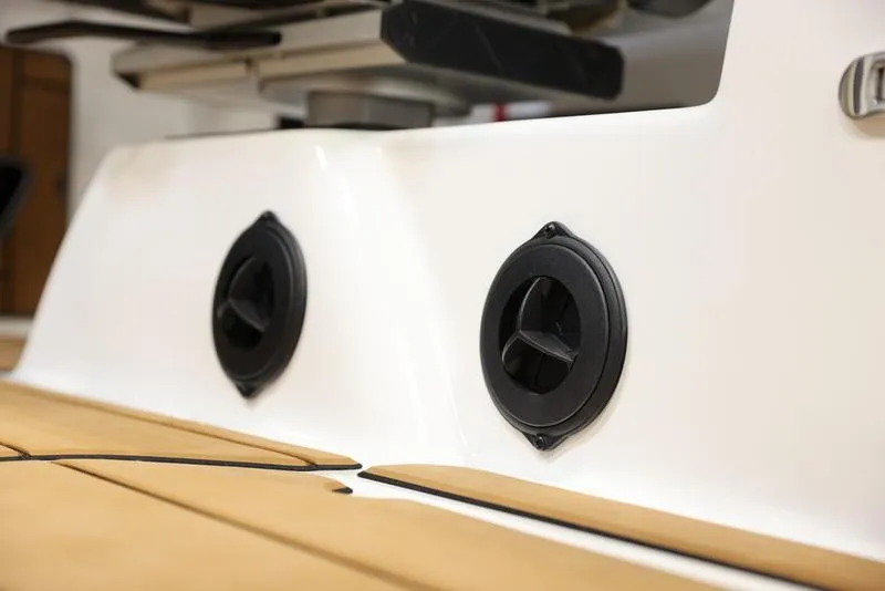 Slide: The Image of 2024 Malibu 24 MXZ boat speakers on deck. - 2