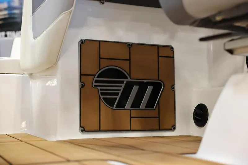 Slide: The Image of 2024 Malibu 24 MXZ boat interior detail with logo. - 22