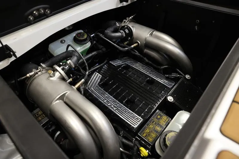 Slide: The Image of 2024 Malibu 24 MXZ boat engine compartment with high-performance components. - 23