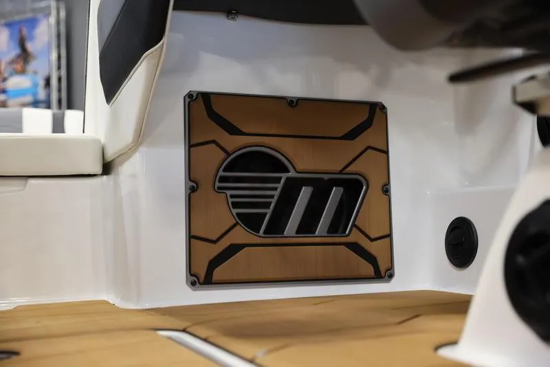 Slide: The Image of 2024 Malibu 23 MXZ boat interior with custom speaker grille. - 10