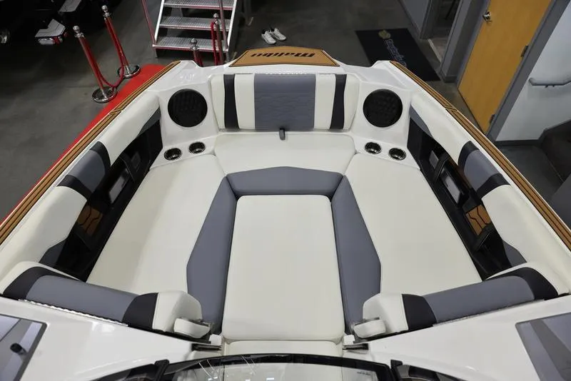 Slide: The Image of 2024 Malibu 23 MXZ boat interior with spacious seating and modern design. - 12